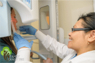 hygienist taking panorex x-ray