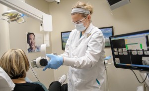 Christina taking an x-ray on a patient