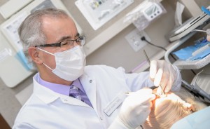 Dr. Bisbey performing a dental exam